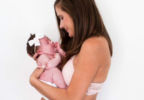 A woman holds a baby A woman holds a baby